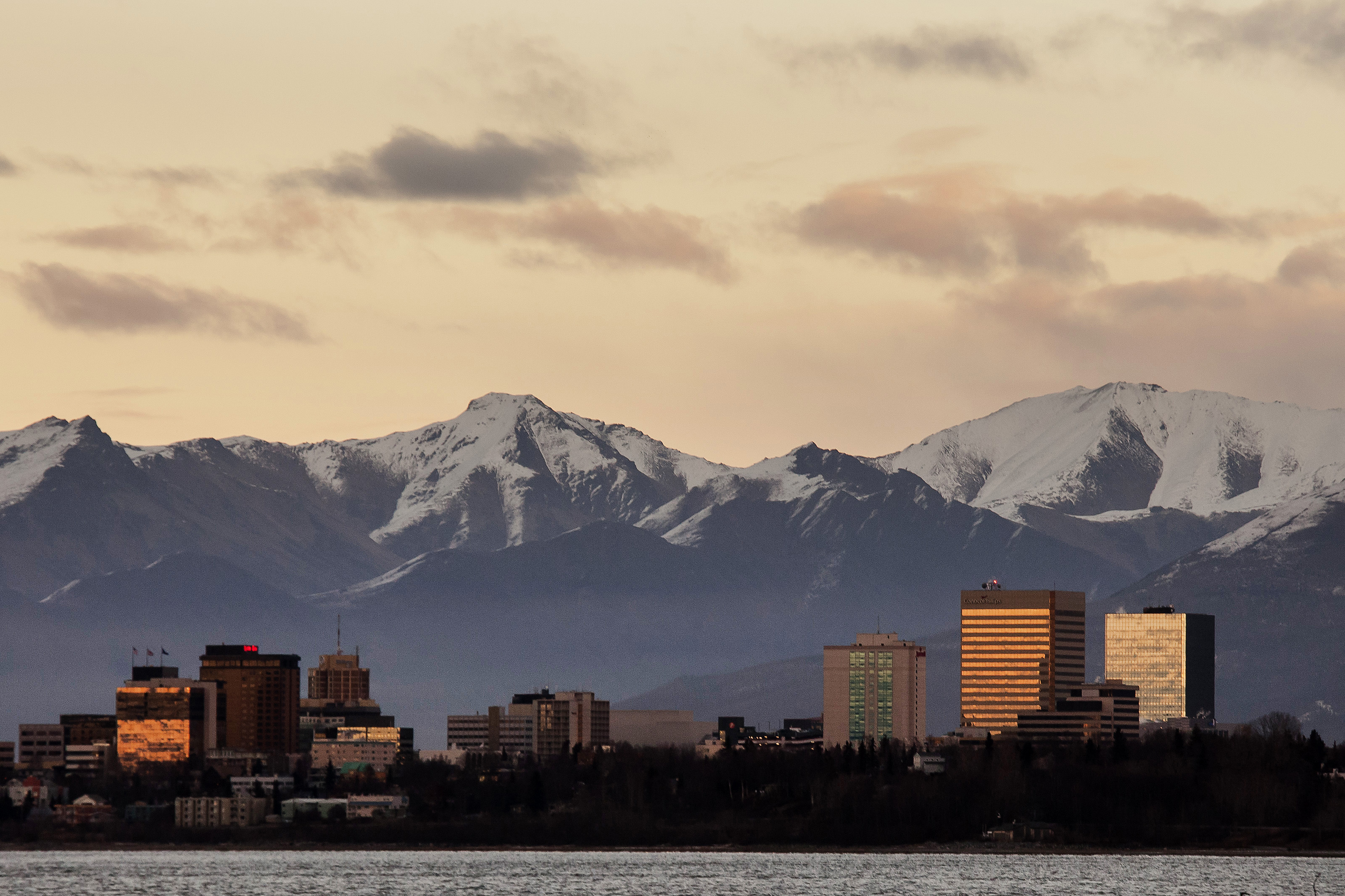 Sunlight reflects off buildings in downtown Anchorage on Nov. 5, 2014. Alaskan cities advertise lifestyle perks to draw new talent. (MUST CREDIT: Bloomberg photo by David Ryder)