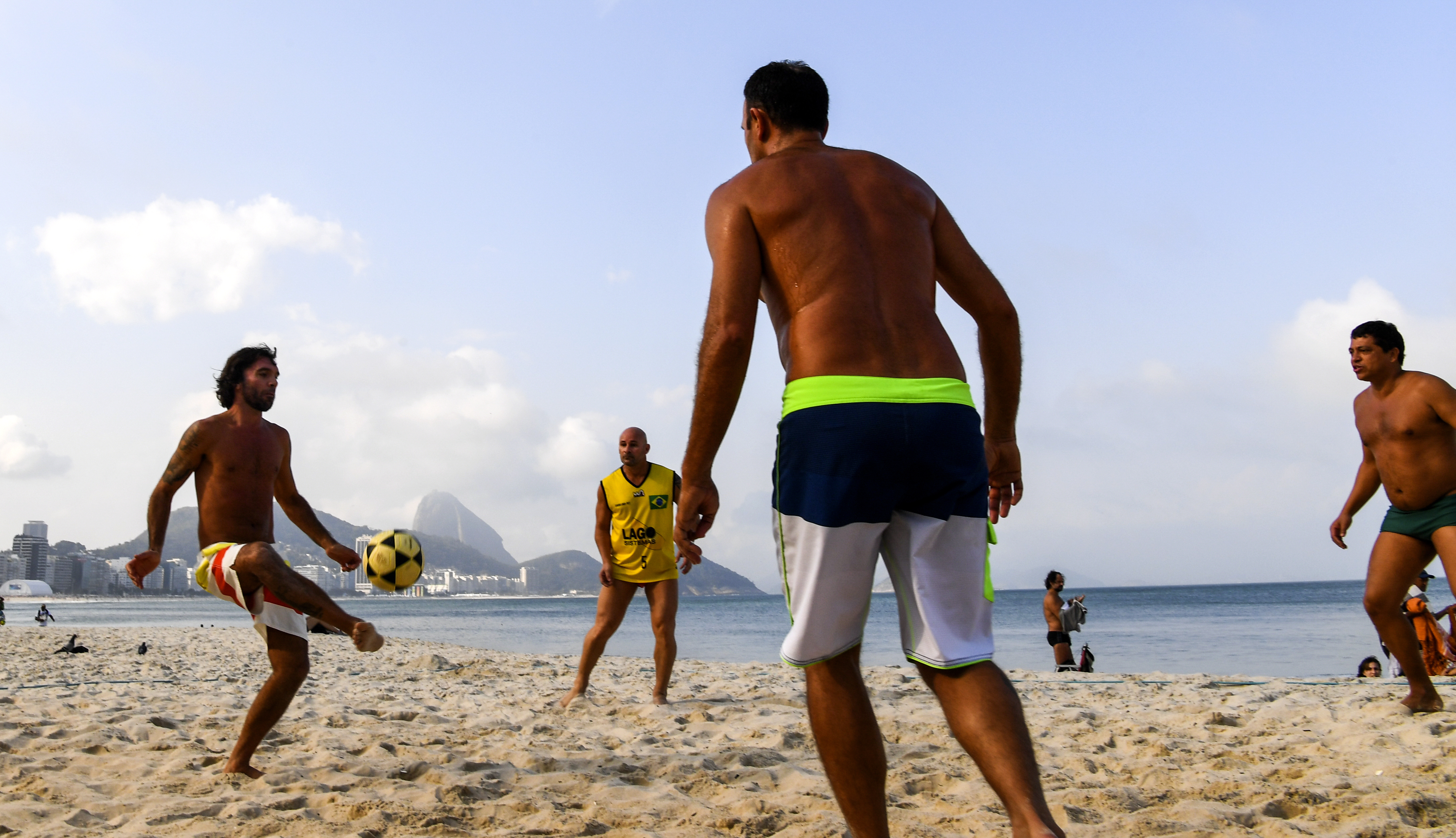 A game of footvolley on the beach at Copacabana. MUST CREDIT: Washington Post photo by Jonathan Newton