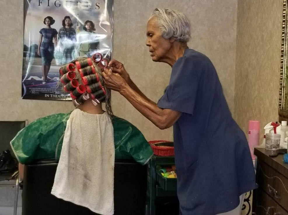 Hairstylist who witnessed history plans to retire at age 100, but not by choice